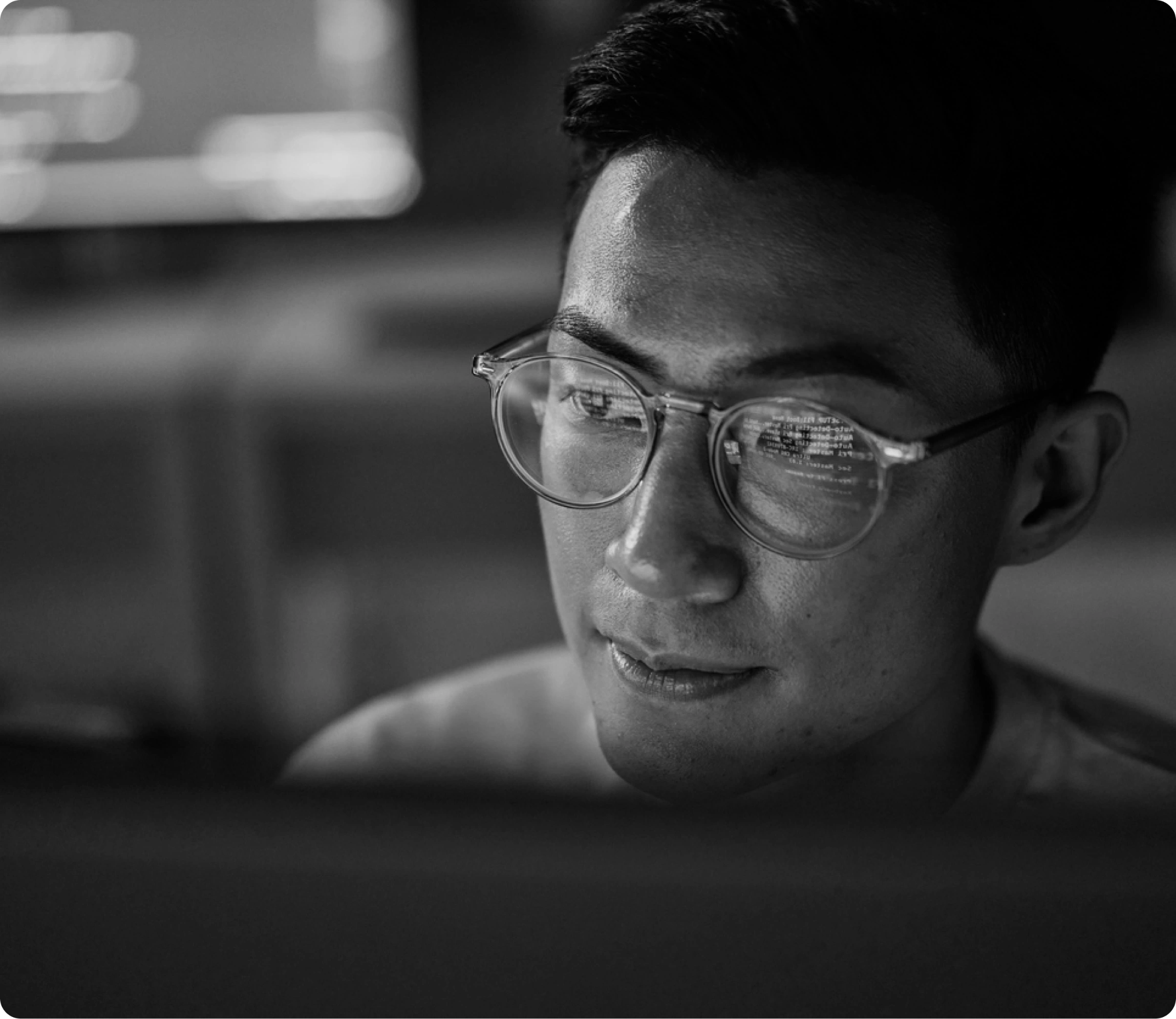 Person focused on a computer, representing OutThink's unparalleled support with human risk benchmarking and product training.